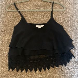 Black ruffle blouse with lace trim. Size small
